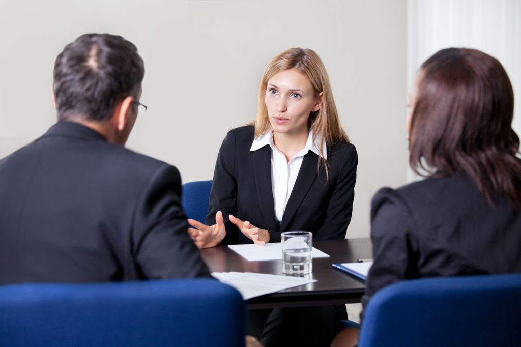 Business partners discussing employment law with lawyer